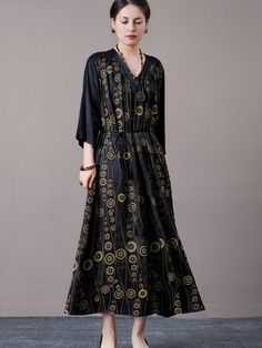 Step out in style with this black and gold geometric print maxi dress. Featuring a striking geometric pattern and a flattering V-neckline, this dress exudes elegance and sophistication. The cinched waist and flowing silhouette provide a comfortable and chic fit, perfect for both formal occasions and stylish everyday wear. Pair with bold accessories and heels for a complete, polished look. Key Features: Black and gold geometric print V-neckline for a flattering look Cinched waist for a chic fit Flowing silhouette for comfort Suitable for formal occasions and everyday wear Gold Bohemian V-neck Dress, Black Maxi Dress For Spring, Black Linen Maxi Dress For Spring, Spring Gold Floor-length Maxi Dress, Gold Maxi Dress For Spring, Flowy Black Maxi Dress With V-neck, Black Flowy V-neck Maxi Dress, Black Bohemian Floor-length Dress, Bohemian Black Floor-length Dress