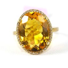 This Is A Fancy Fine Huge Oval Honey Yellow Citrine Ring W/Diamond Halo. It Is Made Of 100% Natural 14kt Yellow Gold And Is In Brand New Condition. It Has A Ctw Of 7.64ct And Weighs 4.4 Grams. The Fancy Diamonds Have A Clarity Of Si2 And G Color. This Beautiful Custom Piece Has An Excellent Oval Cut Yellow Citrine Stone, Surrounded By A Diamond Halo. This Ring Is The Latest In Fashion Design Having Unique Designer Qualities That Is Full Of Shine And Clarity. It Comes With A Bright Shine Polish F Yellow Citrine Ring, Blessed Wednesday, Honey Yellow, Yellow Citrine, Fancy Diamonds, Citrine Ring, Citrine Stone, Unique Designers, Diamond Halo