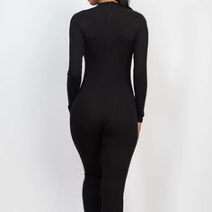 This black jumpsuit features a sleek skinny leg design, perfect for elongating the body and creating a slimming silhouette. Made with high-quality fabric, it provides both comfort and style for a versatile and put-together look. Black Elastane Unitard For Night Out, Black Stretch Jumpsuits And Rompers In Elastane, Black Bodysuit For Party, Chic Long Sleeve Jumpsuits In Elastane, Sleek High Stretch Black Unitard, Sleek High-stretch Black Unitard, Black Elastane Jumpsuits And Rompers For Loungewear, Sleek Black Elastane Jumpsuits And Rompers, Black Bodycon Bodysuit For Loungewear