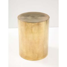 a gold colored metal container on a white background