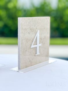 a white table with a number four on it