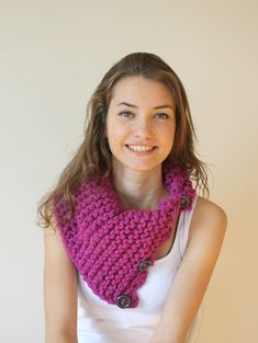 a woman wearing a purple knitted cowl