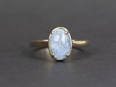 ♥ 1.96ct Oval Blue Dumortierite Quartz 9K Gold Ring♥ Solid 9k yellow gold ring set with a beautiful oval-shaped quartz♥ Gorgeous blue color!♥ The item measures 10.9 mm in length, 6.5 mm in width, and stands 6.8 mm from the finger
♥ US Size 7 (Free resizing up or down 1 size)♥ Band width: 1.9mm♥ Gemstone: Quartz, 1.96ct; , ct♥ All stone(s) used are genuine, earth-mined, and guaranteed conflict free! As is with anything that is naturally occurring, our gemstones or pearls will have imperfections, Classic Oval Moonstone Ring With Ethical Gemstones, Oval Blue Opal Ring In 14k Gold, Elegant Oval Untreated Opal Ring, Elegant Untreated Oval Opal Ring, Blue Oval Moonstone Ring In 14k Gold, Classic Blue Oval Opal Ring, Oval Solitaire Moonstone Ring In 14k Gold, Untreated Oval Sapphire Ring For Gift, Classic Oval Solitaire Moonstone Ring