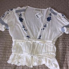 Beautiful White And Blue Peasant Top. Never Worn With Tags. Has Two Ties To Tighten Or Loosen. Looks Great With Jeans. Very Soft Material. Size Medium. Urban Outfitters Top, Peasant Top, Urban Outfitters Tops, Peasant Tops, Soft Material, Looks Great, Urban Outfitters, Blue White, Top Blouse