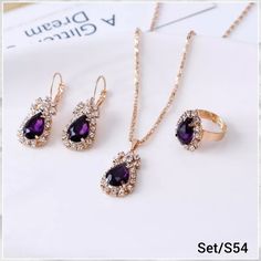 This Set Has 3 Different Things. The Colors Is Gold/Purple ~ Necklace ~ Earrings ~ Ring Purple Bridal Jewellery Set, Purple Crystal Jewelry Sets For Formal Occasions, Formal Purple Crystal Jewelry Sets, Purple Crystal Jewelry Set For Party, Rhinestone Jewelry Set, Double Heart Necklace, Bridal Engagement Rings, Women's Jewelry Sets, Classic Necklace