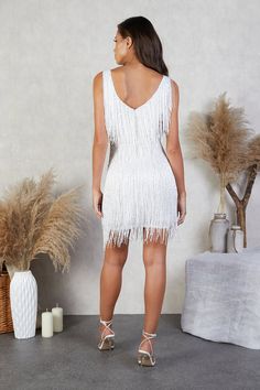 https://player.vimeo.com/external/542647727.hd.mp4?s=1e99d5c8b46d97b10edeea47f563add2f08dc489&profile_id=175 Glamorous V-neck Fringe Dresses, White Glamorous Mini Dress For Prom Season, White Glamorous Mini Dress For Prom, Glamorous White Mini Dress For Prom Season, Glamorous White Mini Dress For Prom, White Glamorous V-neck Sequin Dress, Holiday Fringe Dresses For Night Out, Fringe Dresses For Prom, Glamorous Fringe Dress For Prom