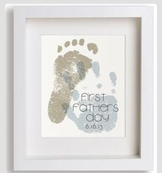 a baby's hand and foot print in a white frame