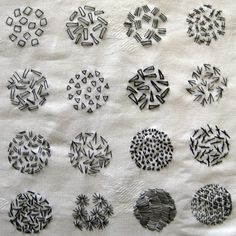 a bunch of black and white designs on a piece of paper that has been cut into smaller circles