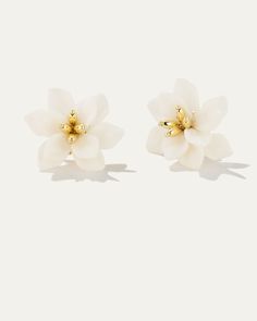 Delicately crafted with the utmost attention to detail, these earrings are a celebration of beauty and sophistication. Each Bloom Flower Stud features meticulously crafted resin petals, capturing the delicate essence of real blooms frozen in time. Embrace the beauty of nature with our Bloom Flower Stud Earrings and add a touch of floral charm to your jewelry collection. Brass dipped in 10k Gold Resin Petals Diameter 1.08" Weight 5.1g