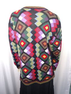 "VTG WOMEN MULTICOLOR CARDIGAN KNIT BLAZER SOFT WINTER CARDIGAN. Colorful cardigan with unique special designed buttons. Very soft lightweight button up sweater. Can be worn all year around. *Size: L *Acrylic *Perfect Condition Measurement: ( Please check the numbers ) *Shoulder: 20\" ( Lowered sleeve ) *Bust: 20\" *Hip: 21\" *Length: 34\" *Sleeve: 18\" Thank you for visiting my store. You can also visit my \" MargaretJewelryShop \"" Multicolor Geometric Pattern Sweater For Fall, Retro Long Sleeve Cardigan With Fair Isle Pattern, Multicolor Long Sleeve Sweater With Geometric Pattern, Retro Long Sleeve Fair Isle Cardigan, Multicolor Geometric Pattern Long Sleeve Sweater, Retro Fair Isle Cardigan, Multicolor Long Sleeve Outerwear With Fair Isle Pattern, Fitted Argyle Pattern Sweater For Fall, Fall Fitted Multicolor Cardigan