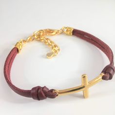 Leather Cross bracelet with adjustable extender chain and lobster claw closure. You may choose from 18 leather color options from the option menu as well as the adjustable size that fits best. Our current production time is 1-3 business days. All our jewelry and gifts are packaged in complimentary gift boxes and a personal note will be included upon request. Please feel free to message us with any question you may have. Thanks for stopping by & God Bless! Adjustable Leather Jewelry With Bracelet Strap, Adjustable Modern Bracelet With Lobster Clasp, Adjustable Brown Bracelet With Lobster Clasp, Adjustable Brown Bracelets With Lobster Clasp, Adjustable Gold Leather Bracelet For Everyday, Adjustable Leather Jewelry For Everyday Wear, Adjustable Leather Jewelry With Lobster Clasp, Leather Jewelry With Adjustable Band For Gift, Adjustable Gold Leather Bracelet Gift