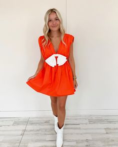 100% Cotton True to size Model is pictured in a size small Orange with white bow