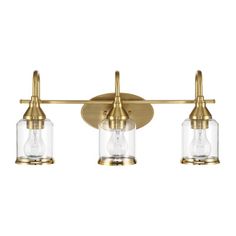 three light brass bathroom fixture with clear glass shades