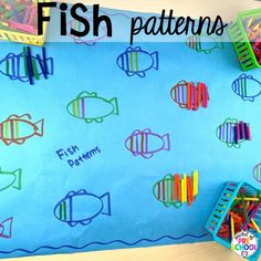 fish patterns on a bulletin board with crayons