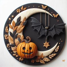 a clock with bats and pumpkins on it's face in the shape of a crescent