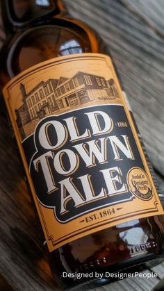 an old town ale bottle sitting on top of a wooden table