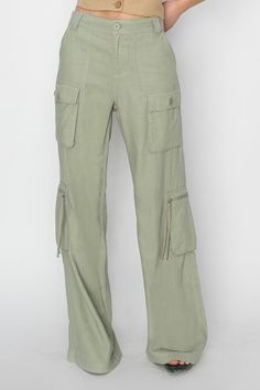 High rise straight leg cargo pant in a pretty sage color with button and zipper front, elastic back band, belt loops and lots of pockets. These are a longer pant. See length measurements below. 55% Cotton, 45% Viscose Turn inside out and wash in cold gentle. Aprox. measurements in inches: S:Length-42 |Waist-30 M:Length Oversized Overalls, Nursing Friendly Tops, Straight Cargo Pants, Modest Midi Dress, Modest Boutique, Nursing Friendly Dress, Modest Maxi, Fashion Modest, Modest Tops