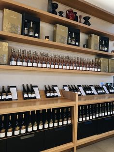 the shelves are full of bottles of wine