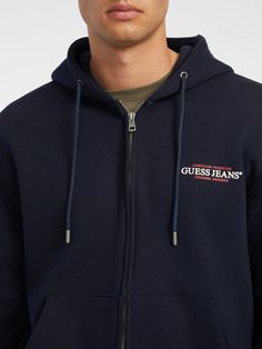 This classic fitting, drawstring zip-up sweatshirt features our mini American Tradition logo, embroidered on the chest. Made with our organic cotton blend. Cotton Hooded Top With Logo Detail, Cotton Outerwear With Logo And Crew Neck, Casual Fleece Tops With Logo Detail, Casual Embroidered Logo Hoodie, Casual Hoodie With Embroidered Logo, Casual Hooded Outerwear With Embroidered Logo, Cotton Hoodie With Zipper Closure, Cotton Hoodie With Embroidered Logo, Casual Hoodie Outerwear With Logo Detail