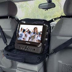 an entertainment system in the back seat of a car, with baseball players on it