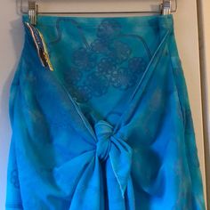 Beautiful Woman’s Pareo. Attached Skirt With Sarong. Can Be Worn Multiple Ways With A Twist Here And Knot There, It Converts To A Sarong, A Halter Top, A Pair Of Shorts Or An Elegant Evening Wrap. (See You Tube For Different Styles). Teal Color With Blue Velvet Flower Swirls. Made Of Poliamida And Elastan. Came In Size 1,2 Or 3. This One Is Size 2 Which Is Medium. Fits Hips Up To 37”. Measures 15” Waist For The Skirt. Skirt Length Is 15”. Sarong Is 37” Long. Light Blue Lined Skirt For The Beach, Light Blue Beach Skirt, Blue Long Wrap Skirt For Beach, Blue Wrap Skirt For Summer Beach, Summer Blue Wrap Skirt For Beach, Blue Wrap Skirt For Beach And Spring, Blue Wrap Skirt For Spring Beach Outings, Casual Blue Sarong, Fitted Blue Wrap Skirt For Beach