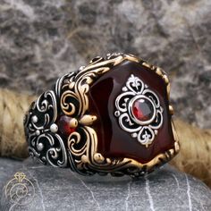 Men's red Ruby gemstone statement ring which will give you a head turning presence. This unique, vintage style, engraved 925 Sterling Silver ring has an exquisite design for the polished, refined, and distinguished man. Perfect for casual and formal events, it will make your friends envious as you walk into the room full of confidence and pride and command attention. Looking for a unique, one of a kind GIFT FOR HIM, groomsman gift, father's day gift, teacher day gift? Look no further. This cool Antique Red Signet Ring For Anniversary, Collectible Red Engraved Ring, Red Carved Vintage Jewelry, Carved Red Vintage Jewelry, Antique Red Gemstone Signet Ring, Vintage Red Engraved Ring For Gift, Antique Red Engraved Ring, Vintage Ruby Signet Ring As Gift, Vintage Red Engraved Ring Hallmarked