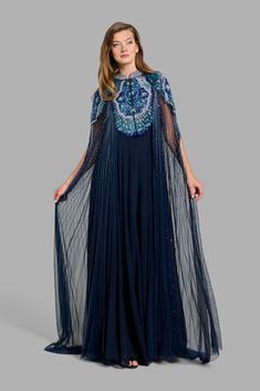 This princess-like Peacock Dress in tulle is carefully crafted with floral patterns and it’s design is further enhanced with embroidered sequins and bugle beads Free worldwide shipping! USE CODE AFTERGLOW10 FOR ADDITIONAL 10% OFF AT CHECKOUT Peacock Dress, The Peacock, S Design, Cape Coat, Bugle Beads, Floral Patterns, Xl Dress, Skirt Top, Coat Dress