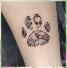 a dog's paw with feathers drawn on it