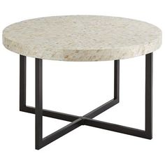 a white marble top coffee table with black metal legs