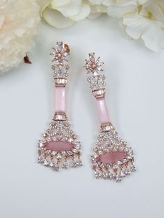 Rose Gold Baby Pink American Diamond CZ Earring. These are an absolute favourite of mine to make to their ethereal look and stunning look. A unique statement piece of jewellery that adds a special touch to any outfit or occasion. they have a pretty shimmer when hits the light.  Material: Brass  Gemstone: Semi precious Stone Elegant Pink Drop Plug Earrings, Rose Gold Drop Earrings For Festive Occasions, Pierced Rose Gold Jewelry For Party, Glamorous Pink Jewelry For Celebration, Rose Gold Single Crystal Earring For Party, Glamorous Pink Earrings For Celebration, Glamorous Pink Teardrop Earrings, Pink Clip-on Earrings For Wedding, Pink Teardrop Jewelry For Evening