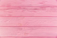 pink painted wood planks with white paint