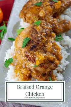 an orange chicken with white rice and garnish on top is served on a plate