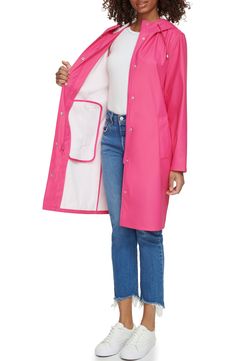 Durable and versatile, this hooded rain jacket features a drawstring hood, covered zipper placket and welt pockets to keep your hands warm and dry. 38 1/2" length Drawstring hood Water-resistant 100% polyurethane Machine wash, tumble dry Imported Pink Waterproof Raincoat For Fall, Trendy Hooded Outerwear For Rainy Weather, Pink Weatherproof Hooded Outerwear, Pink Hooded Weatherproof Outerwear, Pink Weatherproof Outerwear For Fall, Casual Weatherproof Pink Outerwear, Casual Pink Weatherproof Outerwear, Casual Pink Raincoat With Pockets, Spring Raincoat With Double-lined Hood For Rainy Weather