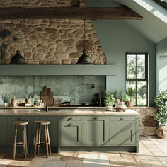 an image of a kitchen setting with green cabinets and stone wall behind the countertop