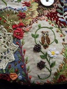 a close up of an embroidered object with buttons on it