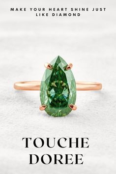 an oval cut green tourmaline gemstone ring in rose gold on a white background