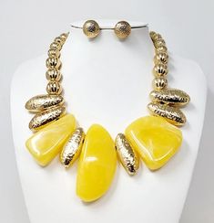 Gold & Yellow Stone Necklace Set 18" adjustable with matching stud earrings Yellow Metal Necklace With Adjustable Chain, Adjustable Gold Costume Jewelry Sets, Adjustable Costume Jewelry Sets With Round Shape, Adjustable Metal Costume Jewelry, Yellow Metal Party Necklace, Adjustable Costume Jewelry Sets For Party, Elegant Yellow Jewelry With Adjustable Chain, Adjustable Necklaces With Matching Earrings, Yellow Metal Costume Jewelry Necklace