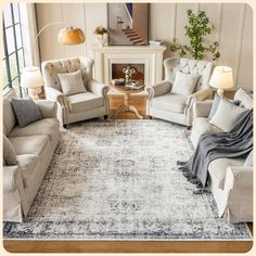 a living room with couches, chairs and a rug on the floor in front of a fireplace