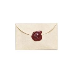 an envelope with a wax seal on the front, and a red wax seal on the back