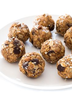 a white plate topped with cookies and granola balls