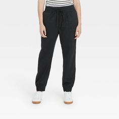 Whether you're hanging out at home or just out running errands, the High-Rise Woven Ankle Jogger Pants from A New Day™ will keep you nice and comfy. In a solid hue, these women's sporty pants are super easy to pair with any style of top for quick everyday styling. They feature elastic-cinched cuffs and an elasticized waist with functional drawstring to let you get the perfect fit with every wear. The jogger pants are woven from a soft and breathable fabric blend, and tailored in relaxed fit for Sweat Pants Women, Joggers Women, Sporty Pants, Black Jogger Pants, Leather Joggers, Black Joggers, Joggers Womens, Fleece Joggers, Faux Leather Pants