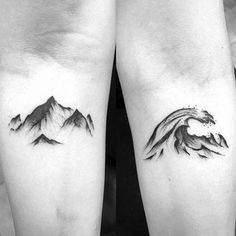 two black and white tattoos with mountains on them