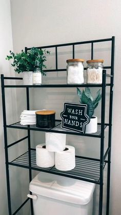 a shelf filled with lots of toilet paper and some plants on top of each shelf