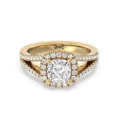 a yellow gold engagement ring with a cushion cut diamond surrounded by round brilliant pave diamonds