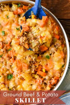 ground beef and potato skillet with a blue spatula scooping up some food