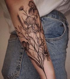 a person with a flower tattoo on their arm