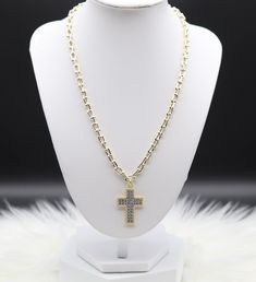 A gold graduate link necklace adorned with a striking CZ-paved cross pendant, seamlessly blending symbolism with contemporary elegance. The intricate cubic zirconia detailing on the cross pendant adds a touch of brilliance, making this necklace a meaningful and stylish accessory for graduates. Length: 20” Closure: Lobster Claw Clover Pendant: 1.20” (Length) 0.89” (Width) Material: Brass with 18K Gold Plating and Rhodium Coating Lead Free and Hypoallergenic Gold Chain Jewelry With Cross Pendant, Elegant Crucifix Cross Necklace With Chain, Gold Cross Pendant Necklace With Rhinestones, Gold Rhinestone Cross Pendant Necklace, Gold Cross Necklace With Rhinestones, Gold Cubic Zirconia Cross Necklace, Gold Cubic Zirconia Crucifix Necklace, Gold Rhinestone Cross Necklace, Gold Cross-shaped Cubic Zirconia Diamond Necklace