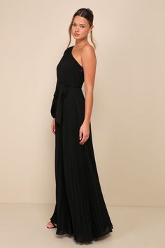 All you have to do is slip into the Lulus Divine Charm Black Pleated One-Shoulder Maxi Dress and you'll feel like pure elegance all night long! Lightweight pleated woven chiffon shapes a trendy one-shoulder neckline and a semi-sheer balloon sleeve (with elastic at the cuff). The high fitted waist features a matching tying sash, that sits atop a twirl-worthy, A-line skirt that falls to a sweeping maxi hem. Hidden side zipper/clasp. Fit: This garment fits true to size. Length: Floor length. Size m Black Bridesmaid Dresses, Pleated Maxi Dress, Dress First, Pleated Dress, A Line Skirts, Floor Length, One Shoulder Dress, One Shoulder, Black Dress