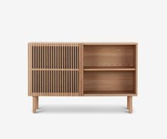 the sideboard is made out of wood and has two open compartments on each side