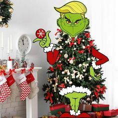 the grinch christmas tree is decorated with presents